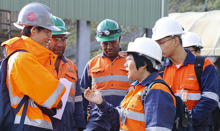 Ms Lin (centre) talks to PJV Managing Director Shaoyang Shen (left) for purposes of translation while looking on are Processing Operations Superintendent Toke Kewe (left to right), Senior Metallurgist Alfred Tom, Zhaolong and Xueling at the Tawisakali plant.Ms Lin (centre) talks to PJV Managing Director Shaoyang Shen (left) for purposes of translation while looking on are Processing Operations Superintendent Toke Kewe (left to right), Senior Metallurgist Alfred Tom, Zhaolong and Xueling at the Tawisakali plant.